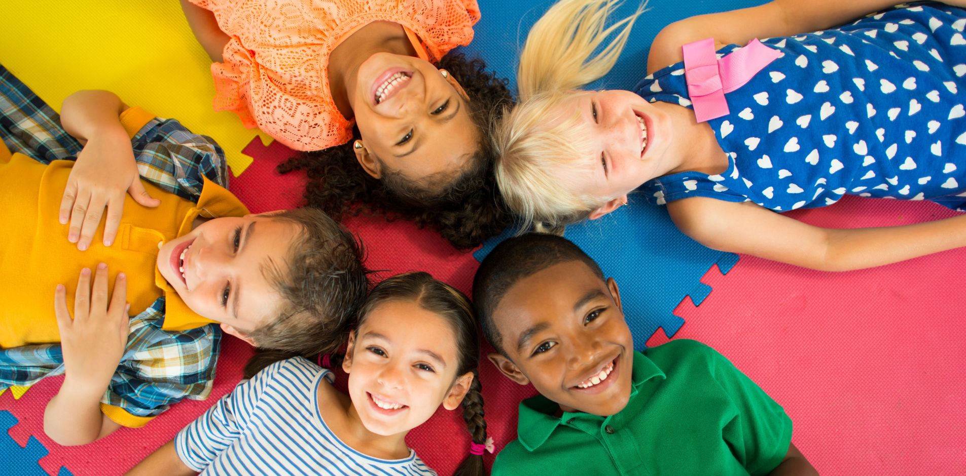 kids smiling in a circle